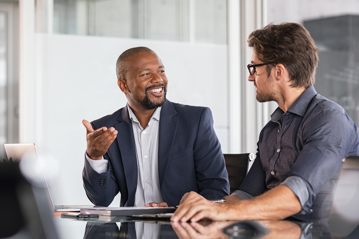 Two people talking in an office environment